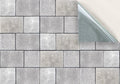 Close-up of gray flagstone tiles or paving slabs forming a pattern